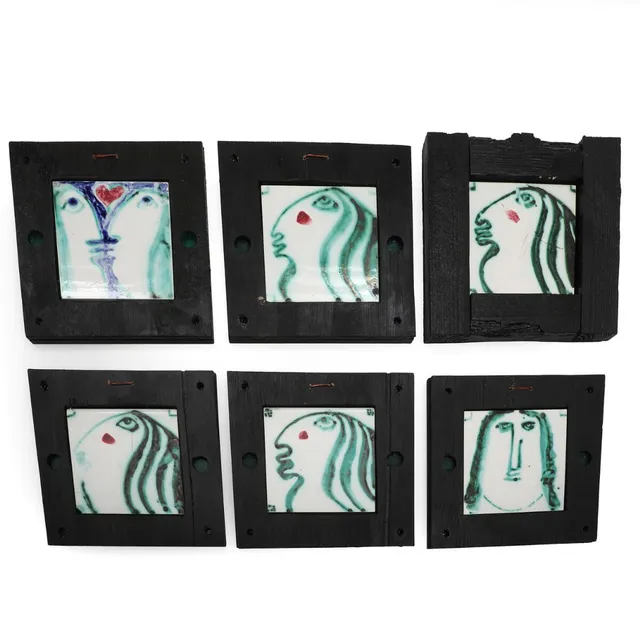 “Eva” a.o. Six glazed ceramic tiles, mounted in black-painted frames. Unsigned. Each 15×15. Incl. frames 25×25–26×26 cm. (6)