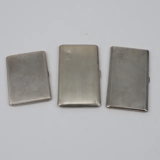 THREE GEORGE VI CIGARETTE CASES:-.