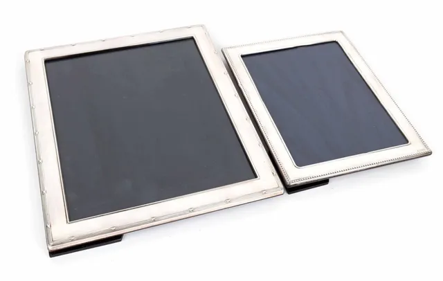 Two English CARRS sterling silver photo frames. (2)