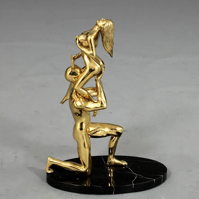 ROBBI JONES. "Kvinnan och Djävulen", skulptur, mässing, sign.