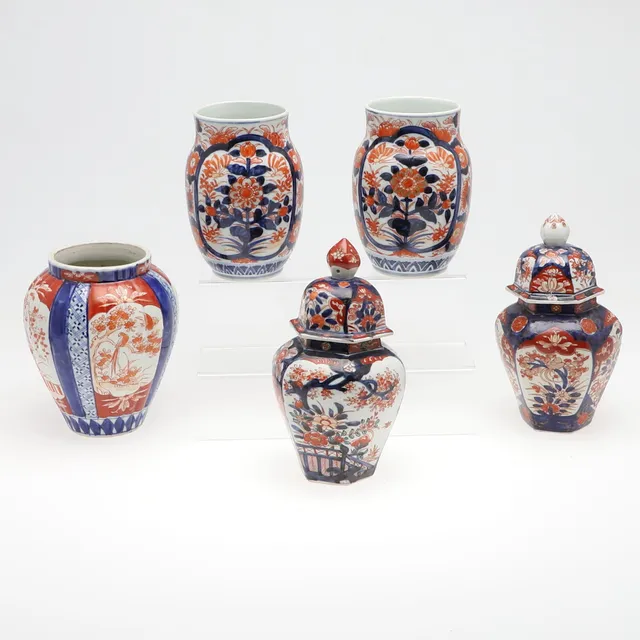 TWO 19TH CENTURY JAPANESE IMARI SIX SIDED VASES AND COVERS.
