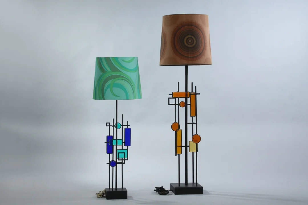 Svend Aage Holm Sørensen. Two sculptural floor/table lamps, iron and glass, from the 1960s. — Lamps and lighting/Table lamps — Lauritz