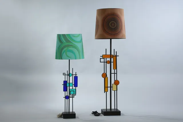 Svend Aage Holm Sørensen. Two sculptural floor/table lamps, iron and glass, from the 1960s.