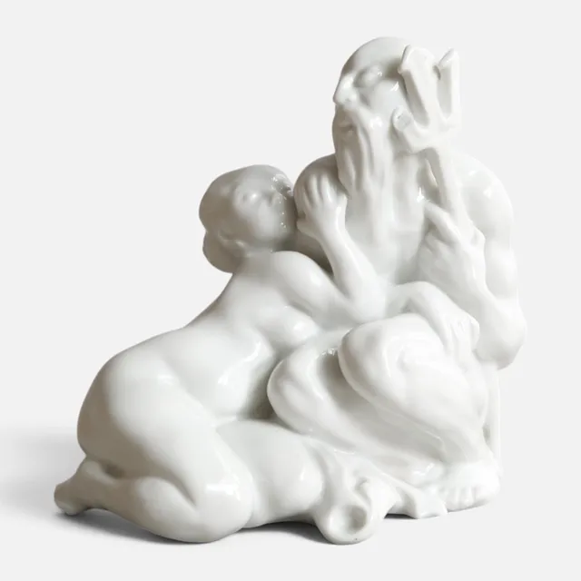 KAI NIELSEN. "Neptun & kvinde på fisk", figur af blanc de chine. Udført og mærket hos Bing & Grøndahl, dessinnr. 30.