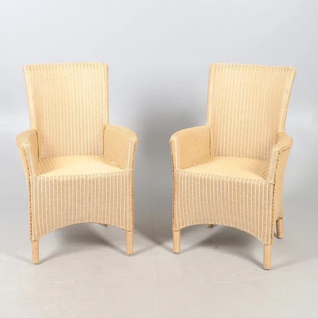 A PAIR OF BAKER LOOM WICKER CONSERVATORY CHAIRS.