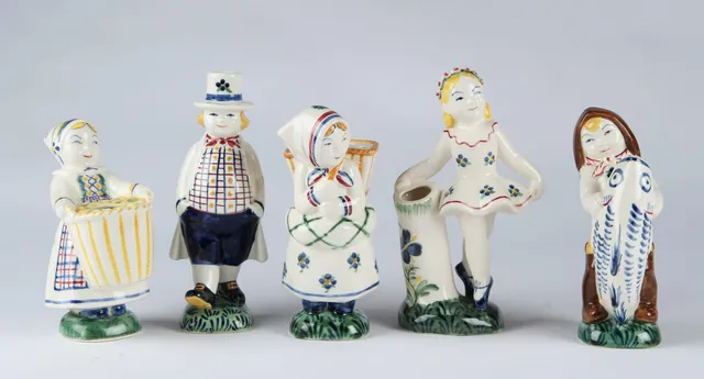 Aluminum. A collection of earthenware Children's Aid Day figurines (5)