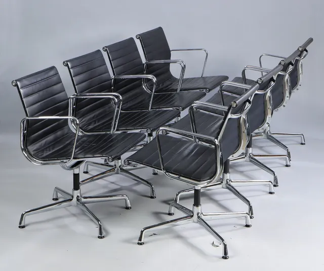Charles Eames. A set of eight armchairs, model EA 108, black leather. (8)
