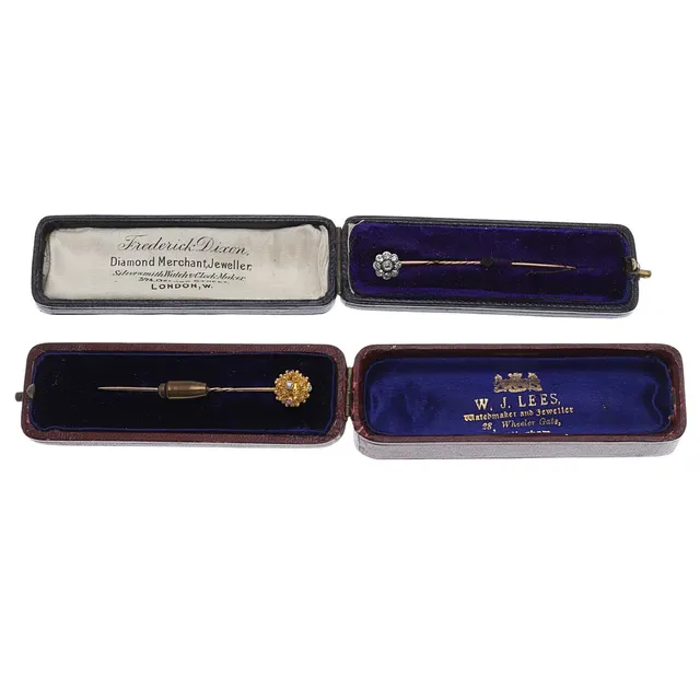 TWO GOLD AND GEM SET STICK PINS.