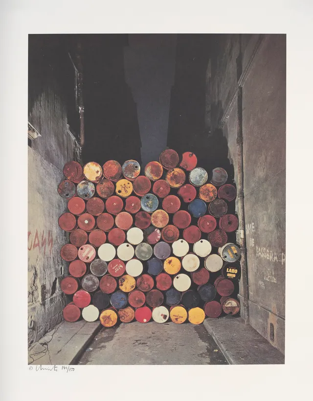 Christo & Jeanne-Claude — "Wall of Oil Barrels - The Iron Curtain, Rue Visconti, Paris, 1961-62" 1990