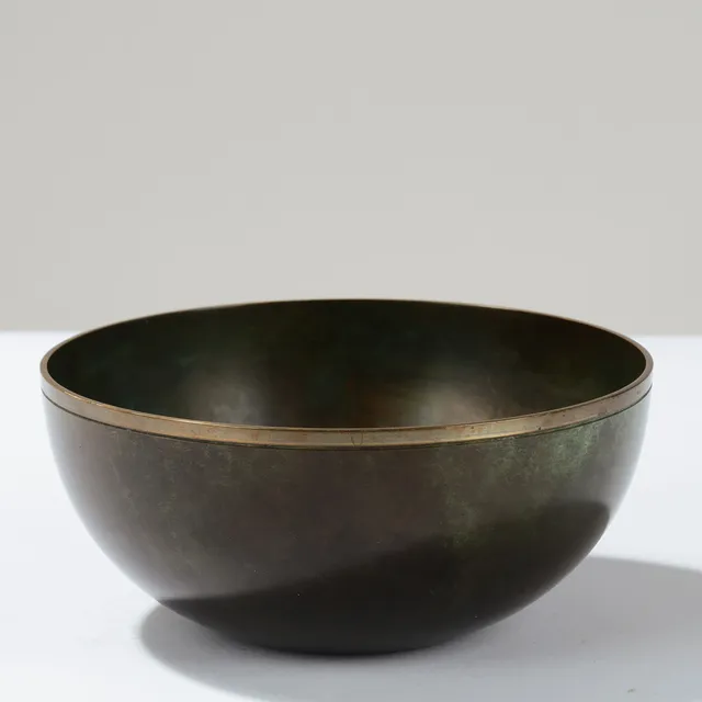 JUST ANDERSEN (1884-1943). Bowl of dark- and green-patinated bronze with a gilded top rim, model no. B1514, designed in 1934, executed at his own workshop in Copenhagen, Denmark.