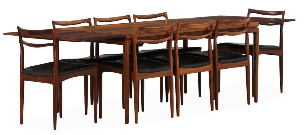 Eight chairs and table with two extension leaves in rosewood. Seat upholstered in black leather. Chairs: Model 94. Manufactured and marked by Chr. Linneberg. Table: H. 72 cm. L. 165/265 cm. W. 90 cm. (11) — Modern Furniture — Bruun Rasmussen