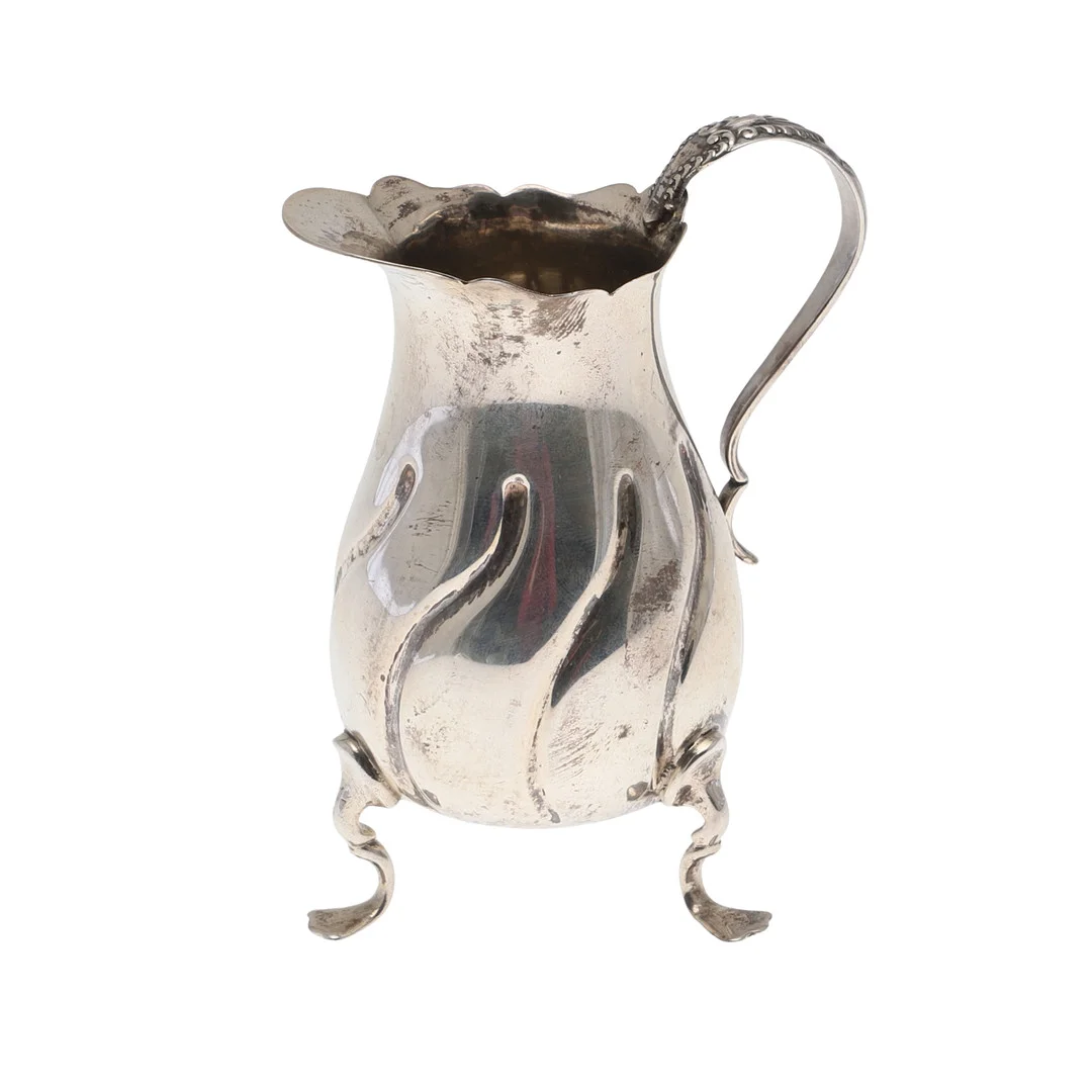 A LATE VICTORIAN SILVER CREAM JUG. — Silver — Lawrences Auctioneers