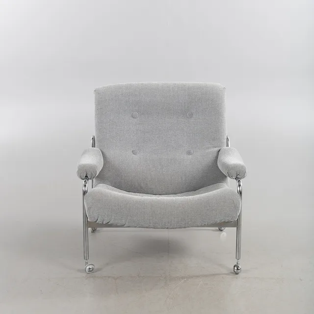 INGE ANDERSSON. Fåtölj, Bröderna Anderssons Industrier, Ekenässjön, 1970-tal, stomme i kromat stålrör, klädsel i textil.