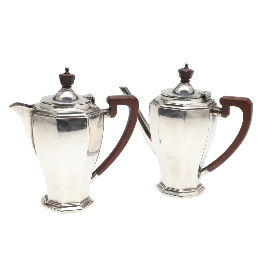 A SILVER TWO PART CAFE AU LAIT SET. — Silver — Lawrences Auctioneers