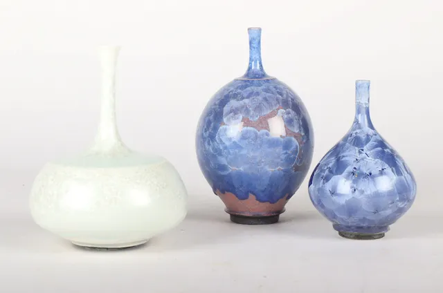 Isak Isaksson. Three vases of stoneware with crystal glaze. (3)