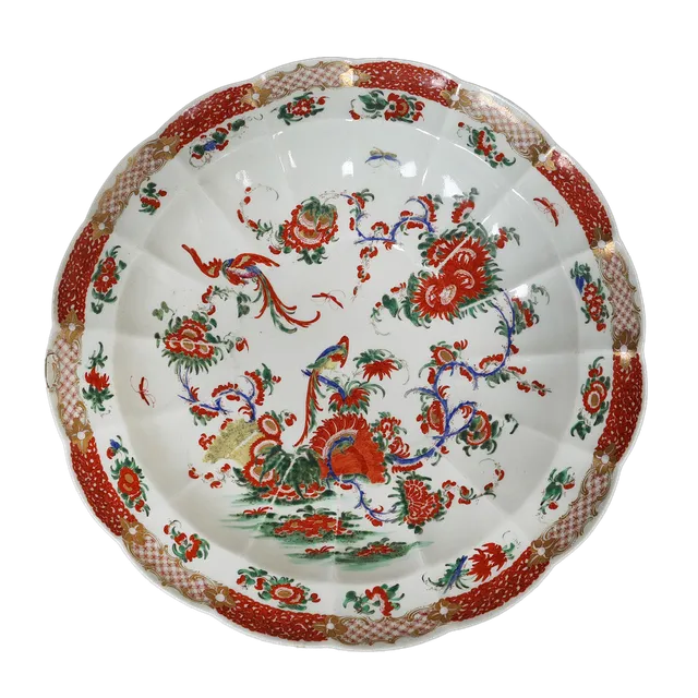 A WORCESTER CUSPED SHAPED "PHOENIX" PATTERN DISH PAINTED IN THE RICH KAKIEMON PALETTE, CIRCA 1768-1770.
