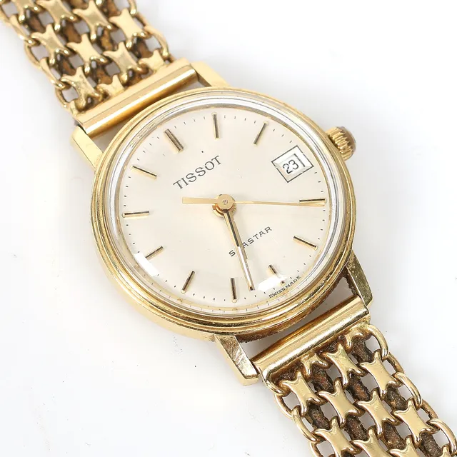 ARMBANDSUR och ARMBAND, 18k guld, Tissot Seastar, IPO Handels, Sundsvall. Bruttovikt 26,5 gram.