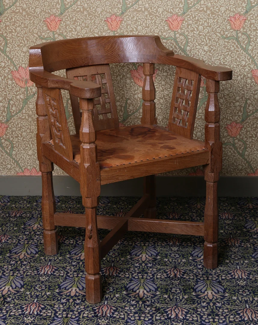 A ROBERT "MOUSEMAN" THOMPSON OAK DESK CHAIR WITH LATTICE BACK. — Armchairs & Chairs — Bishop & Miller