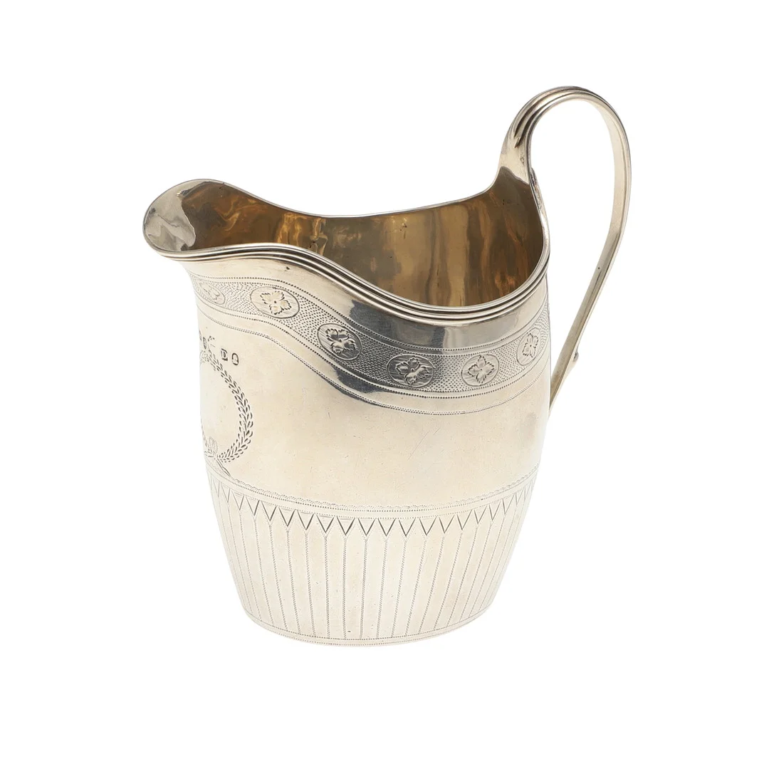 A GEORGE III HELMET SHAPED CREAM JUG. — Silver — Lawrences Auctioneers