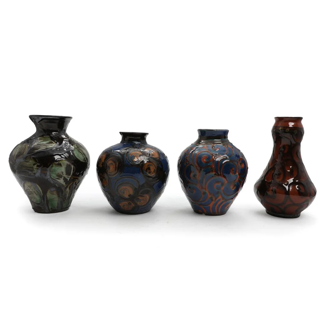 Four earthenware vases decorated with brown, blue and green glazes. Signed HAK. Manufactured by Kähler. H. 19.5–22.5 cm. (4) — Modern Decorative Art — Bruun Rasmussen