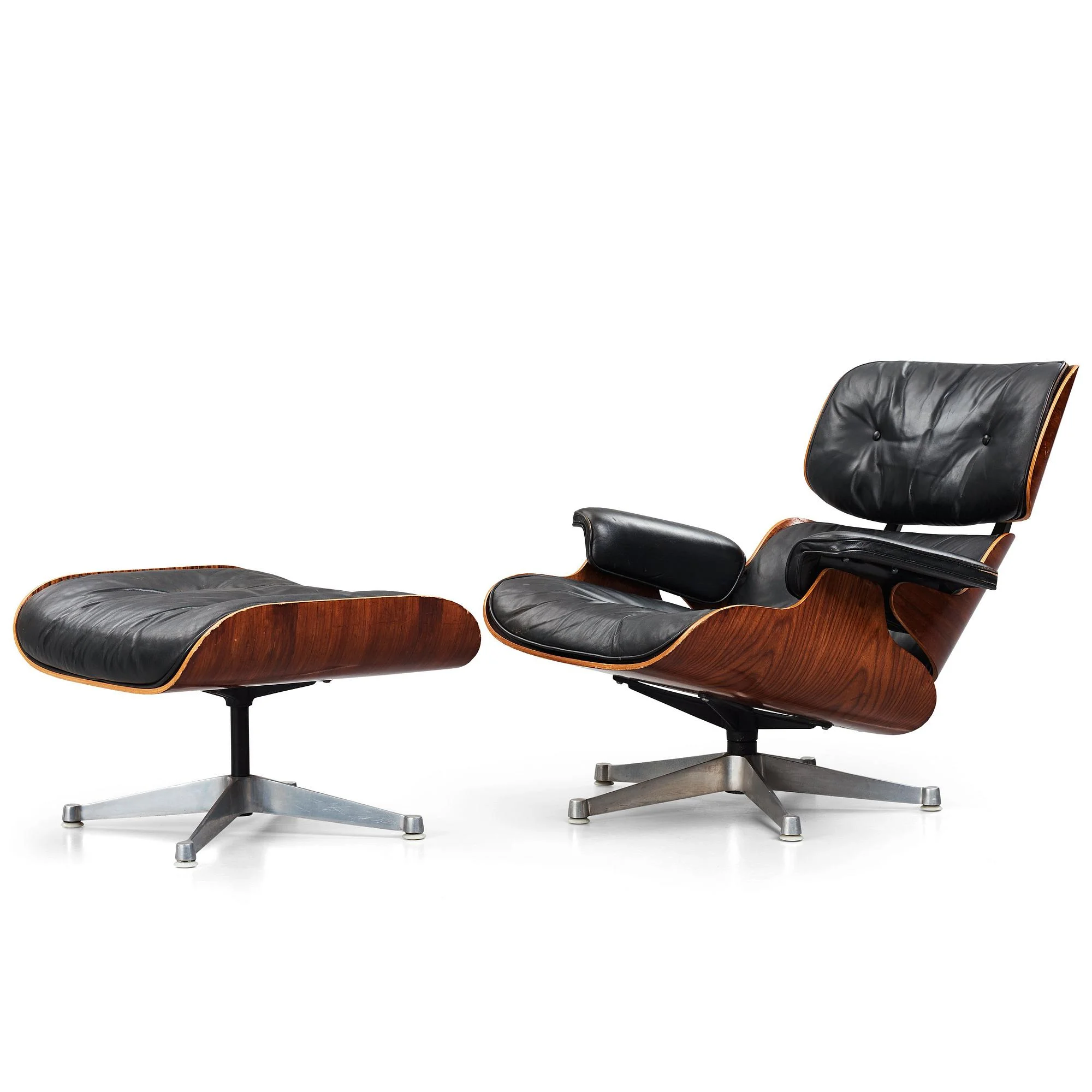 Charles & Ray Eames, "Lounge chair", fåtölj och ottoman, Vitra 1960-70-tal. — Bukowskis