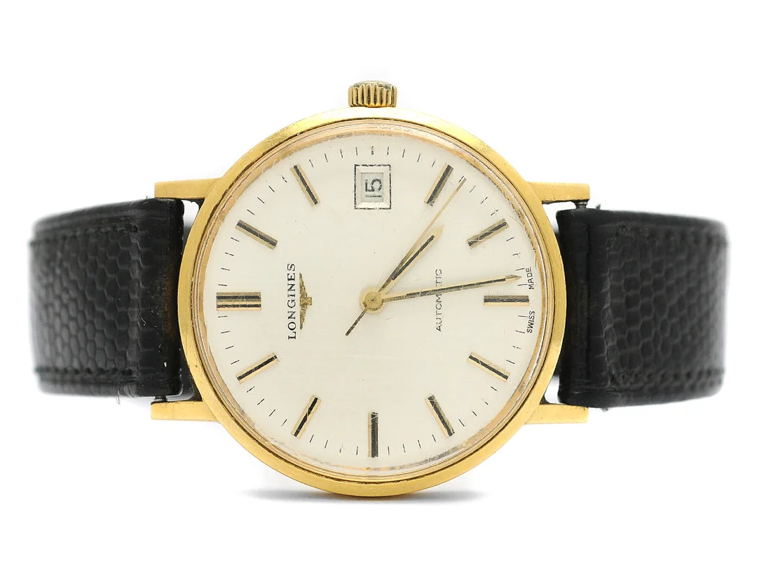 LONGINES, herrur, 35 mm, Cal L.633.1, Serie nr. 53183848, Ref nr. 1603, Boett nr. 18077740, 18K guld, automatisk, plexiglas, datum, skadad urtavla, läderband, ca 1977. — Klockor/Longines — Kaplans