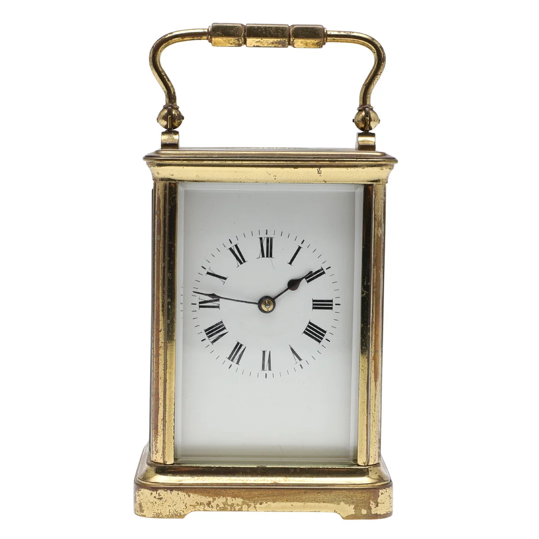 A BRASS CASED CARRIAGE TIME PIECE. — Mantel clocks — Lawrences Auctioneers