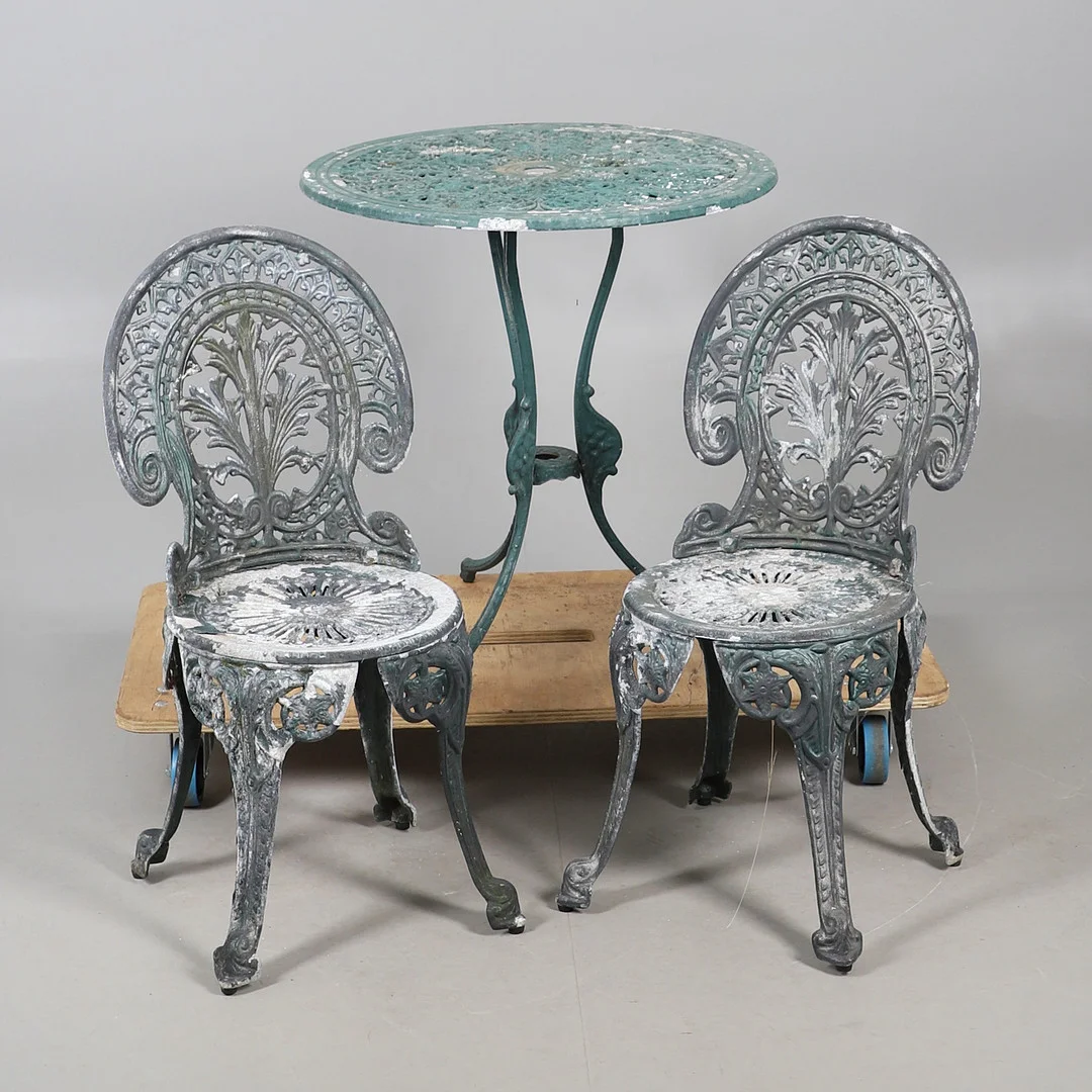 A GREEN PAINTED PATIO TABLE AND CHAIRS SET. — Garden — Lawrences Auctioneers