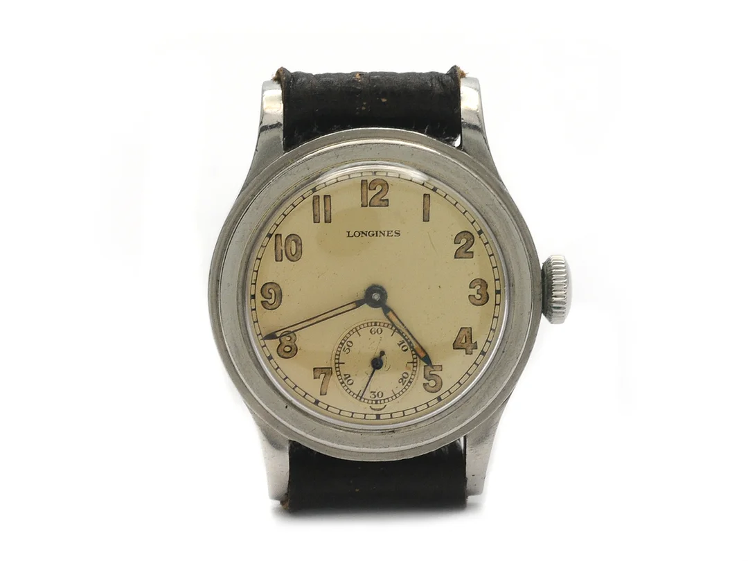 LONGINES, herrur, 31 mm, Cal 10.68 Z, Serie nr. 6076025, Boett nr. 21253/51, stål (staybrite), manuell, plexiglas, liten sekundvisare, skadad urtavla, skadad boett, läderband, ca 1940. — Klockor/Longines — Kaplans