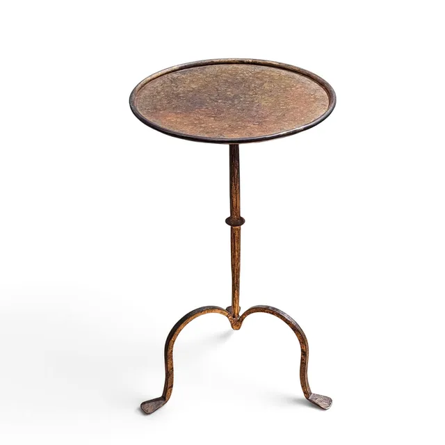 Mesa "Martini" en hierro colado sobredorado.