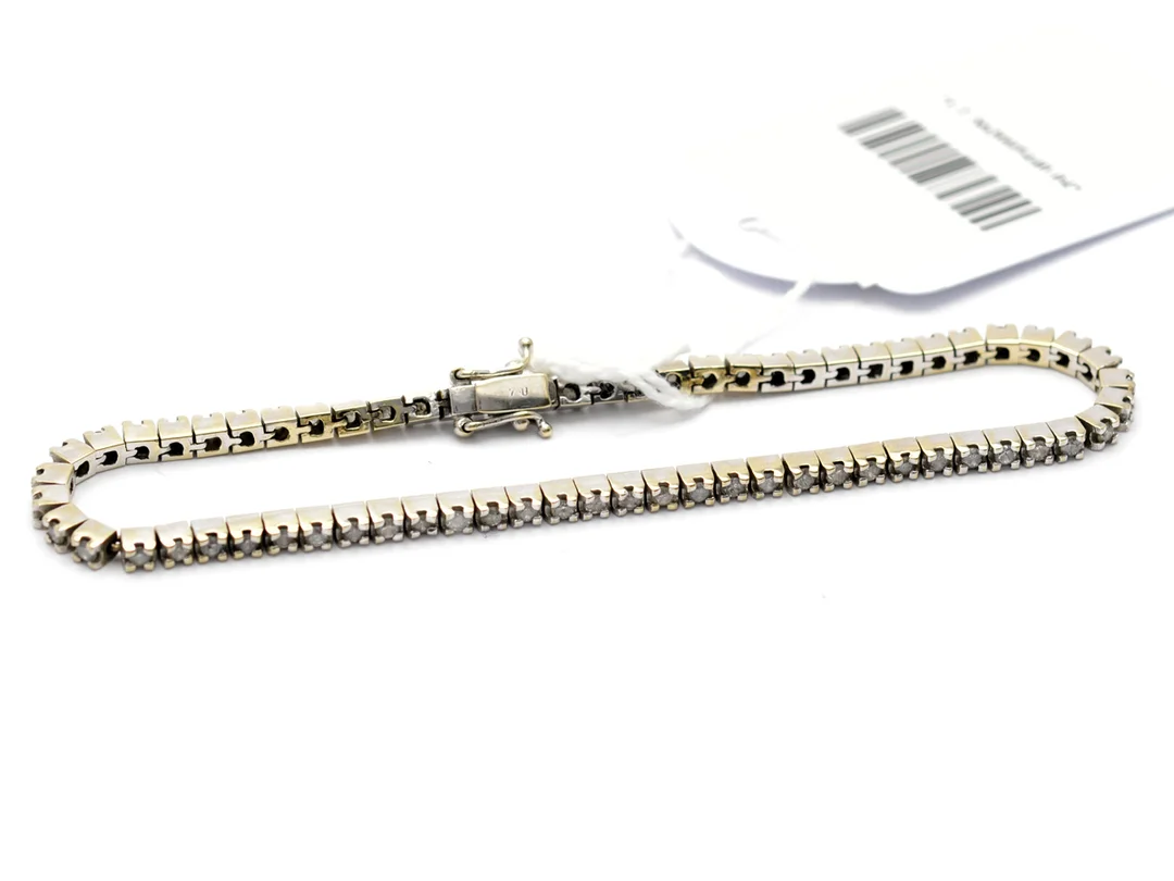 Armand i vitguld 18K 14,0g 19,5cm med diamanter 65 x ca 0,02ct, inneslutningar, Tennisamband — Smycken/Armband — Kaplans