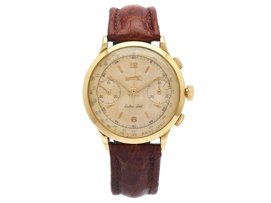 EBERHARD & Co. Extra-fort, Cal Valjoux 65, Boett nr. 1034811, kronograf, herrur, 39 mm, 18K guld, manuell, plexiglas, enknappskronograf med stoppknapp, läderband, ca 1960. — Klockor/Eberhard & Co — Kaplans
