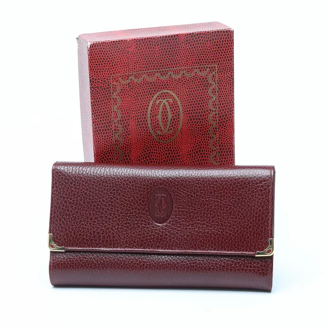 CARTIER, plånbok, Les Must de Cartier, bordeaux färgat skinn, 1980-tal.
