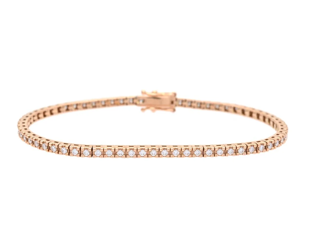 TENNISARMBAND, 18K roséguld, briljantslipade diamanter ca 0,88 ctv, ca TW-W/VS, längd 16 cm, vikt 8,5 g. — Smycken/Tennisarmband — Kaplans
