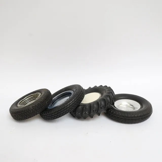 ASKFAT, 4st, föreställande däck, gummi och glas, och metall, Goodrich, Svenska gummifabriken AB, firestone, med flera.