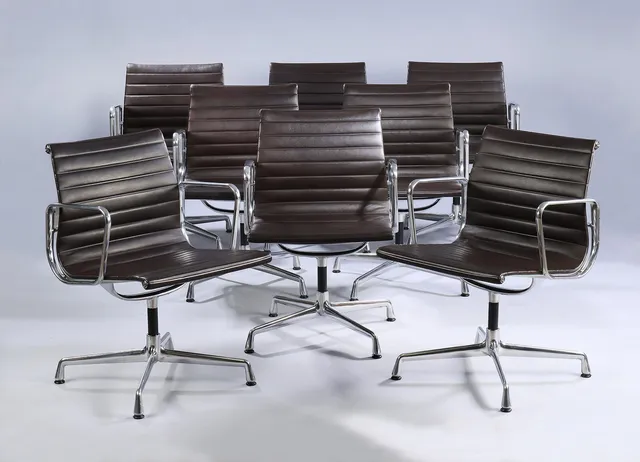 Charles Eames. A set of eight armchairs, model EA 108, brown leather. (8)