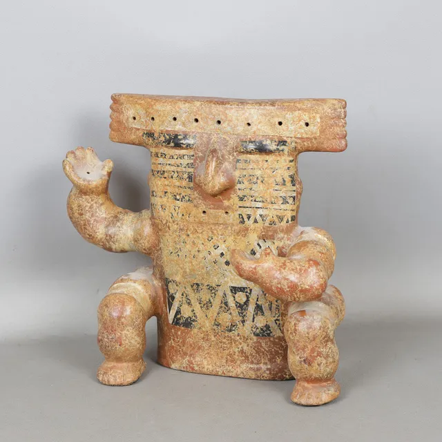 A PRE-COLOMBIAN STYLE POTTERY FIGURE.
