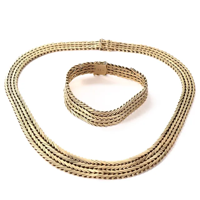 Aage Albing. Geneva necklace in progression and bracelet of 14 kt. gold. (2)