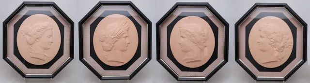 "The Four Seasons", four classic-style reliefs in patinated stucco, 20th Century.