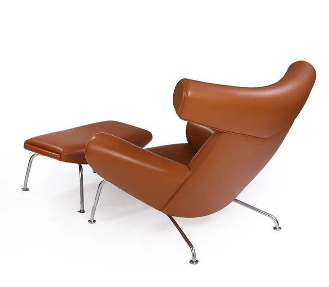 Hans J. Wegner. 'Ox-chair' with stool in cognac-colored leather (2)
