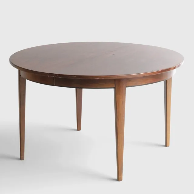 GUNNI OMANN. Cirkulært spisebord af palisander med udtræk, tilspidsede ben, tre medfølgende tillægsplader. Udført hos Omann Jun's Møbelfabrik, model '55'. Danmark, 1960'erne (1+3).