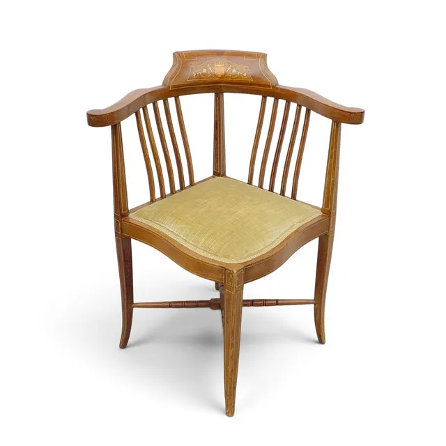 AN EDWARDIAN INLAID MAHOGANY COMFORT CHAIR.