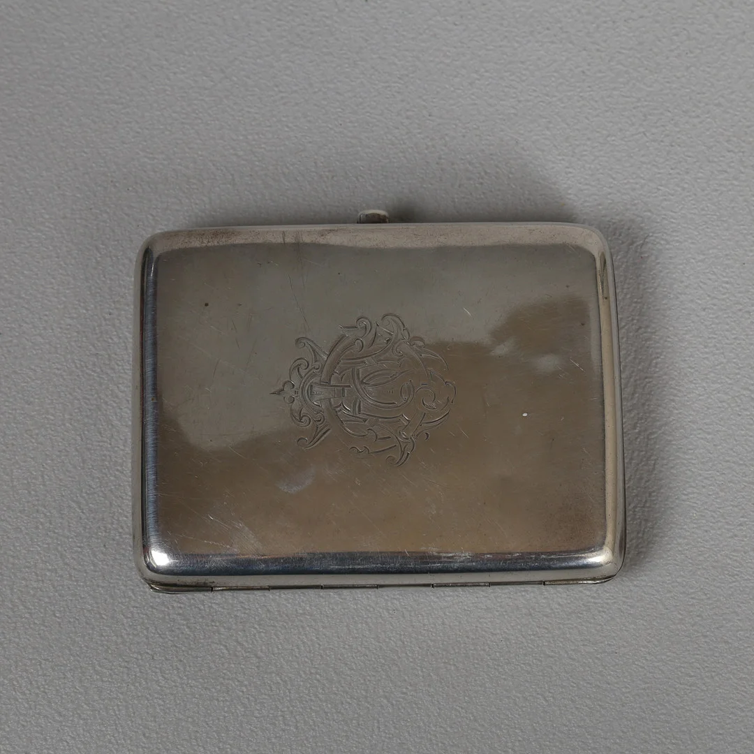 AN EDWARD VII SILVER COMBINATION CIGARETTE CASE, VESTA, STAMP CASE & COIN HOLDER. — Silver — Bishop & Miller