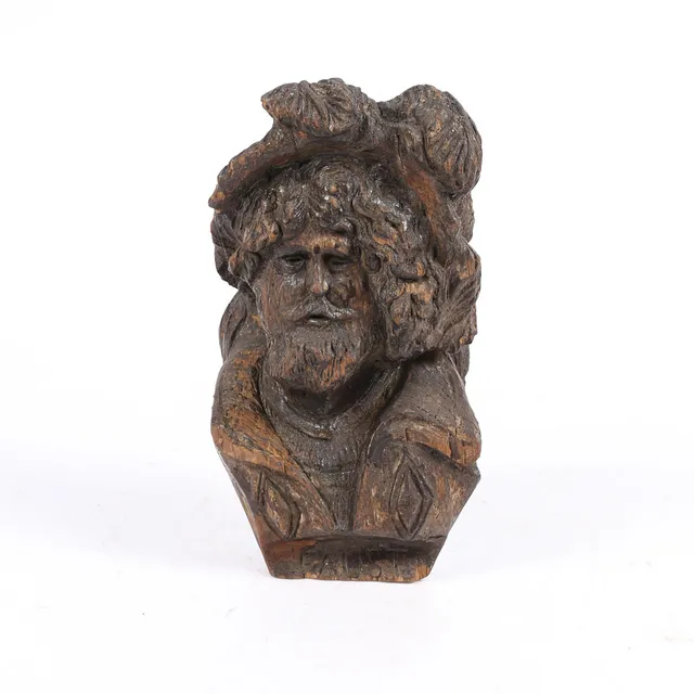 A 18TH CENTURY CARVED OAK BUST OF FAUST, PROBABLY DUTCH.