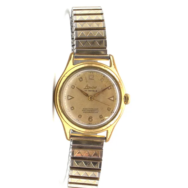 LACO HERRENARMBANDUHR, HANDAUFZUG, VERGOLDETES GEHÄUSE, CHAMPAGNERFARBENES ZIFFERNBLATT; SHOCKPROOF, ANTIMAGNETIC, WATERPROOF UM CA. 1950.