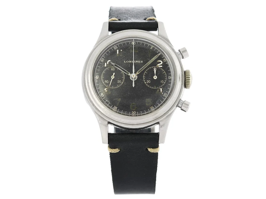 LONGINES, kronograf (Flyback), s.k. "Doppia Linguetta", Cal 13 ZN, Serie nr. 7309365, Ref nr. 5415, Boett nr. 23485 / 19, herrur, 37 mm, stål, manuell, plexiglas, utbytt minutvisare, läderband, "Extract from the Archives", levererad till den svenska agenten Terrasse 1/11 1948. — Klockor/Longines — Kaplans