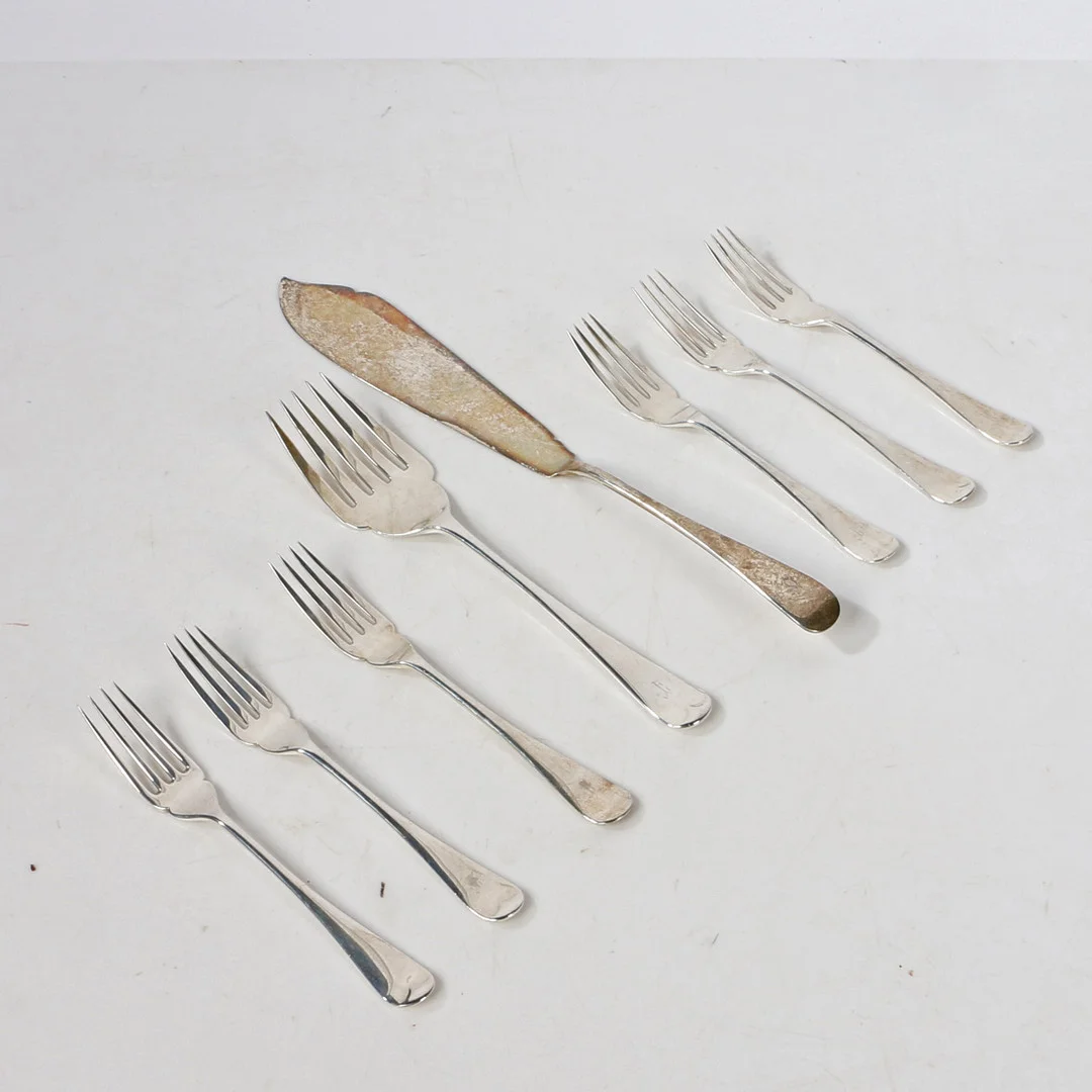 A SET SIX GEORGE V SILVER FORKS TOGETHER WITH SILVER FISH SERVERS. — Silver — Bishop & Miller