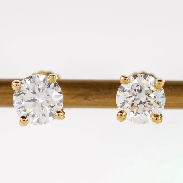 A pair of solitaire earrings in 14 kt. gold set with lab-created diamonds totaling 1.00 ct. (2)