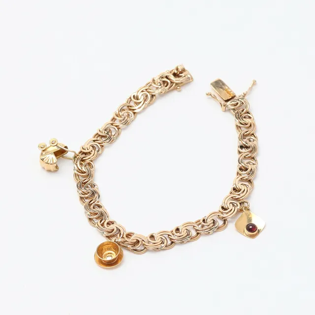 ARMBAND, guld, 18K med berlocker i form av bla. tekopp.