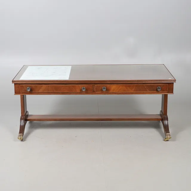A REGENCY STYLE MAHOGANY LOW STRETCHER TABLE.